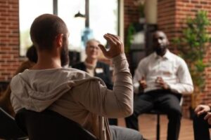 man meets with therapist at suboxone treatment program